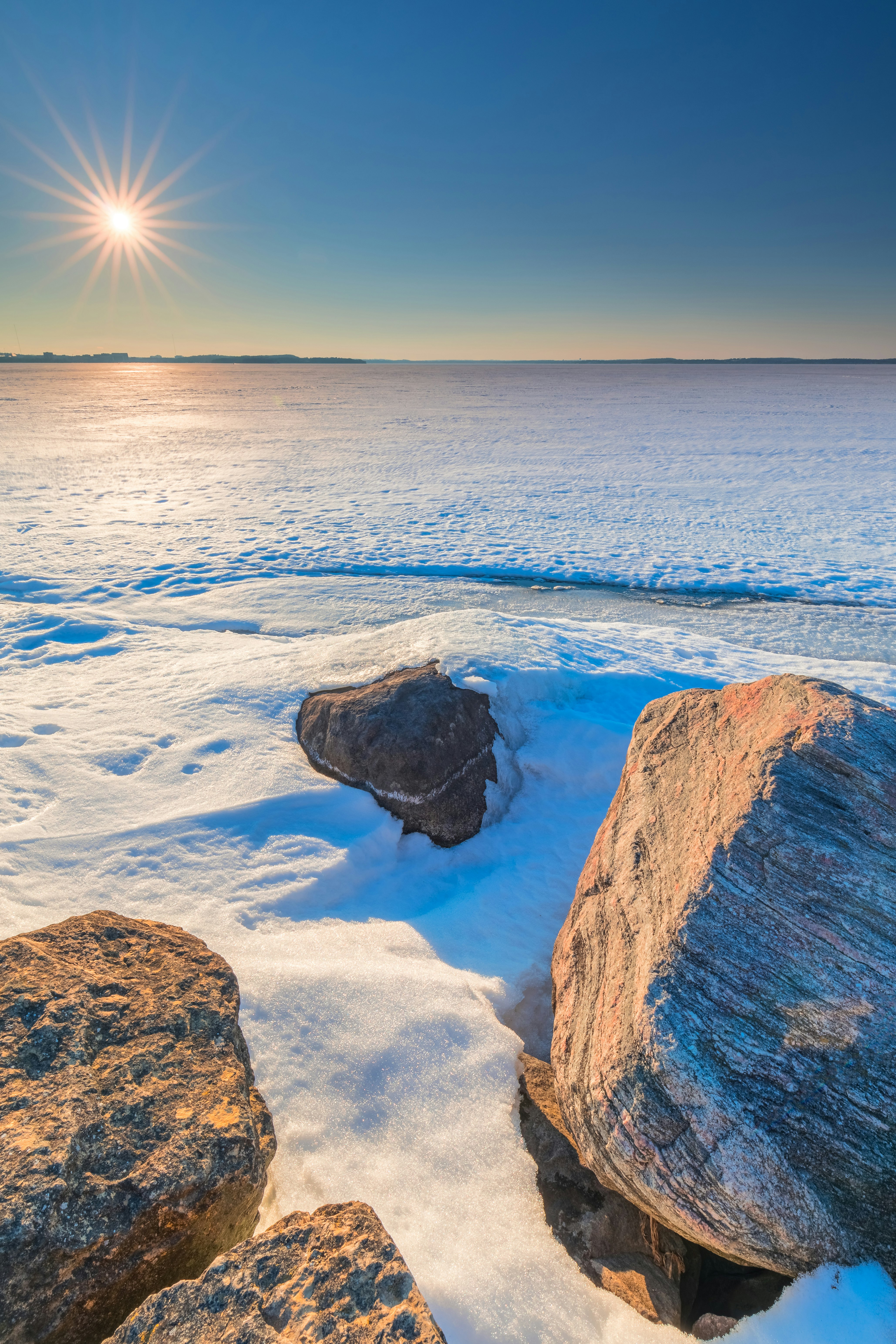 brown rock formation on blue sea water during daytime